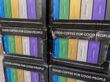 several boxes of coffee are stacked on top of each other