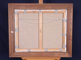 a picture of an easel with a picture hanging on it