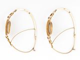 two pairs of gold hoop earrings on a white background