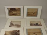 four framed photographs of a group of people in a field