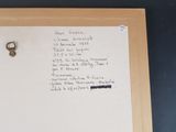 a piece of paper with a note attached to it