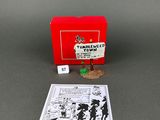 a red box with a card and dice game in it
