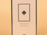 an image of a box of playing cards on a yellow background