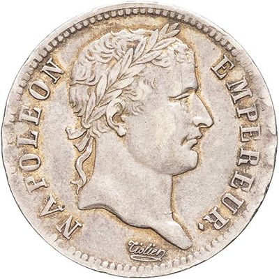 a close up of a coin with a man ' s head on it