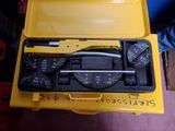 a yellow tool box with tools inside of it
