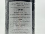 a bottle of wine sitting on a table with a label on it