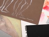 many different types of art work on the table