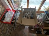 a box with a doll inside of it sitting on the floor