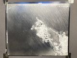 a picture of a picture of a wave coming in from the ocean