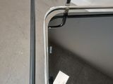 a mirror that is sitting on the floor next to a wall