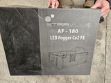 someone is holding a box with a light inside of it