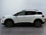 the white suv is parked in a parking lot