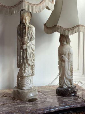 two lamps that are on a table in a room