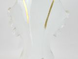 an image of a white vase with gold trims