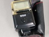 a small camera that is sitting on a cloth