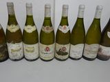 six bottles of wine are lined up in a row on a table