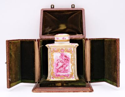 a pink and gold box with a pink and white picture on it