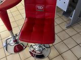 a red chair and a red table in a room