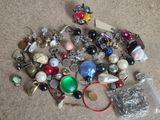 a pile of assorted jewelry on the floor