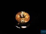 a yellow diamond on a black background