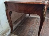 a table that is sitting on a hard wood floor