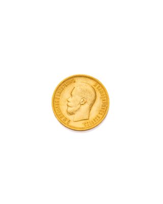 une pièce d'or sur laquelle est représentée la tête d'un homme