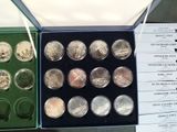 a lot of different coins in a box on a table