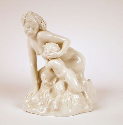 a statue of a woman sitting on a tree stump