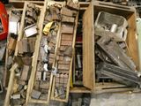 a box full of assorted metal items on the floor