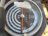 a close up of a gauge on a motorcycle