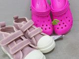 two pairs of pink and white crocs and a pair of pink and white crocs