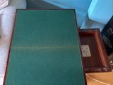 a table with a green mat on it next to a bed