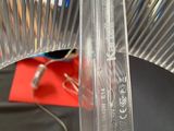 a clear plastic object that is on a black table
