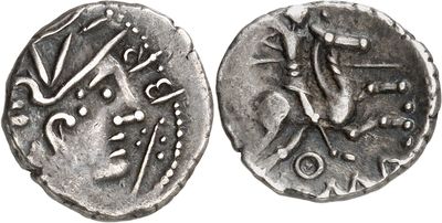 a close up of a silver coin with a bird on it