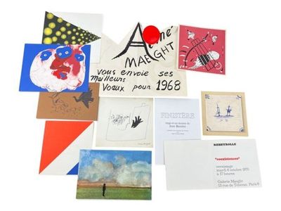 many cards and postcards on a white surface