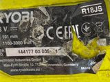 a close up of a label on the back of a yellow vehicle