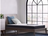 an image of a bed with a mattress on it in front of a window