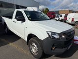 a picture of a white pick up truck parked in a parking lot