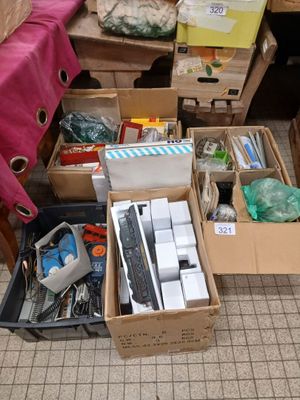 many boxes of assorted items sitting on the floor