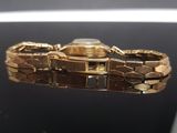 a watch that is sitting on a glass table