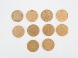 six different types of gold coins are arranged in a circle