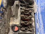 a blue case with tools inside of it on the floor