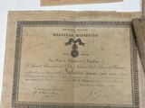 an old document sitting on top of a table next to a pair of scissors