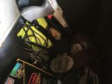 a black trash can with a bunch of items inside of it