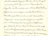 une lettre écrite en cursive sur une feuille de papier