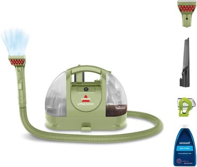 a close up of a vacuum cleaner with a hose and a spray bottle