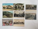 many old postcards of people and buildings on the wall