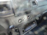 a dashboard of a car with a lot of buttons on it