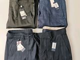 trois paires de pantalons de ville pour homme, encore étiquetés