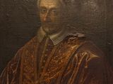 tableau représentant un homme vêtu d'une robe marron et d'un chapeau rouge